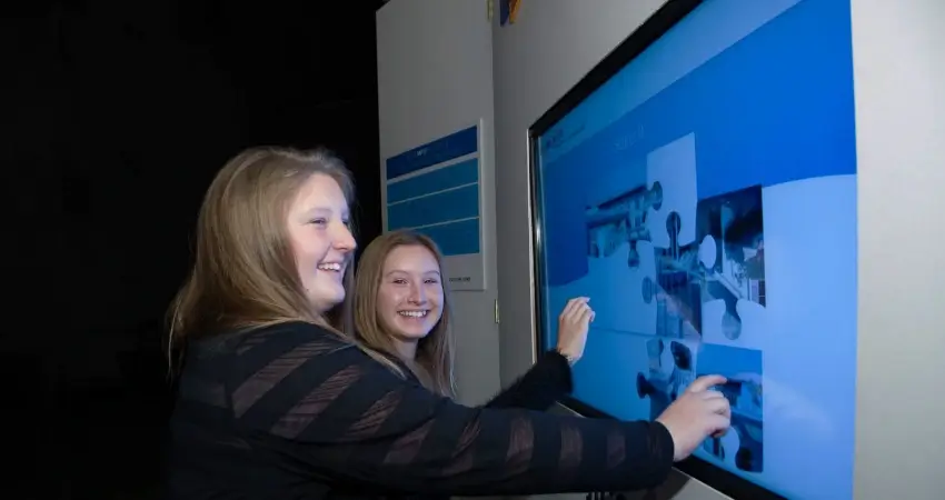 Guests interacting with the interactive display